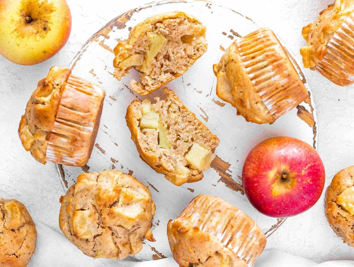 cut open apple muffin with apple chunks and grated apples