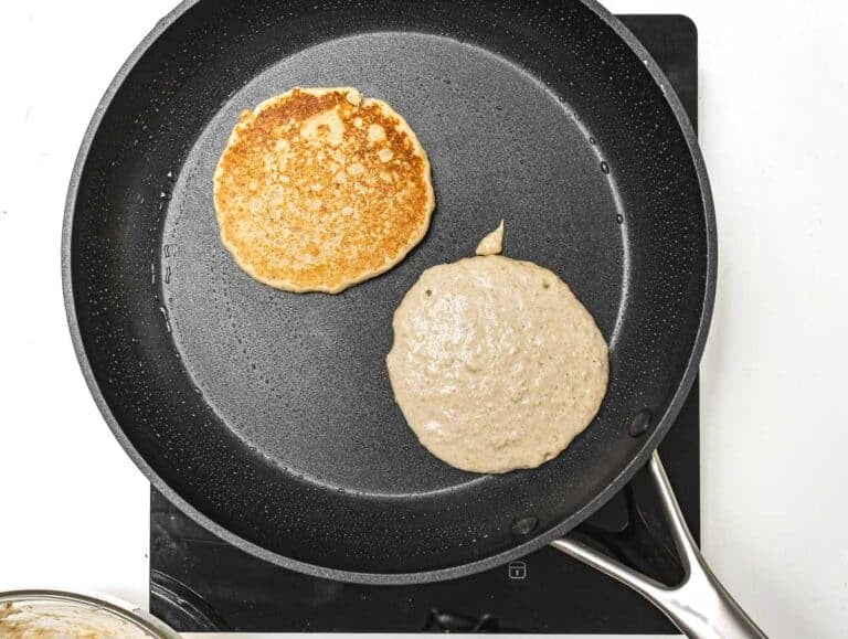 oatmeal pancakes cooking on a pan