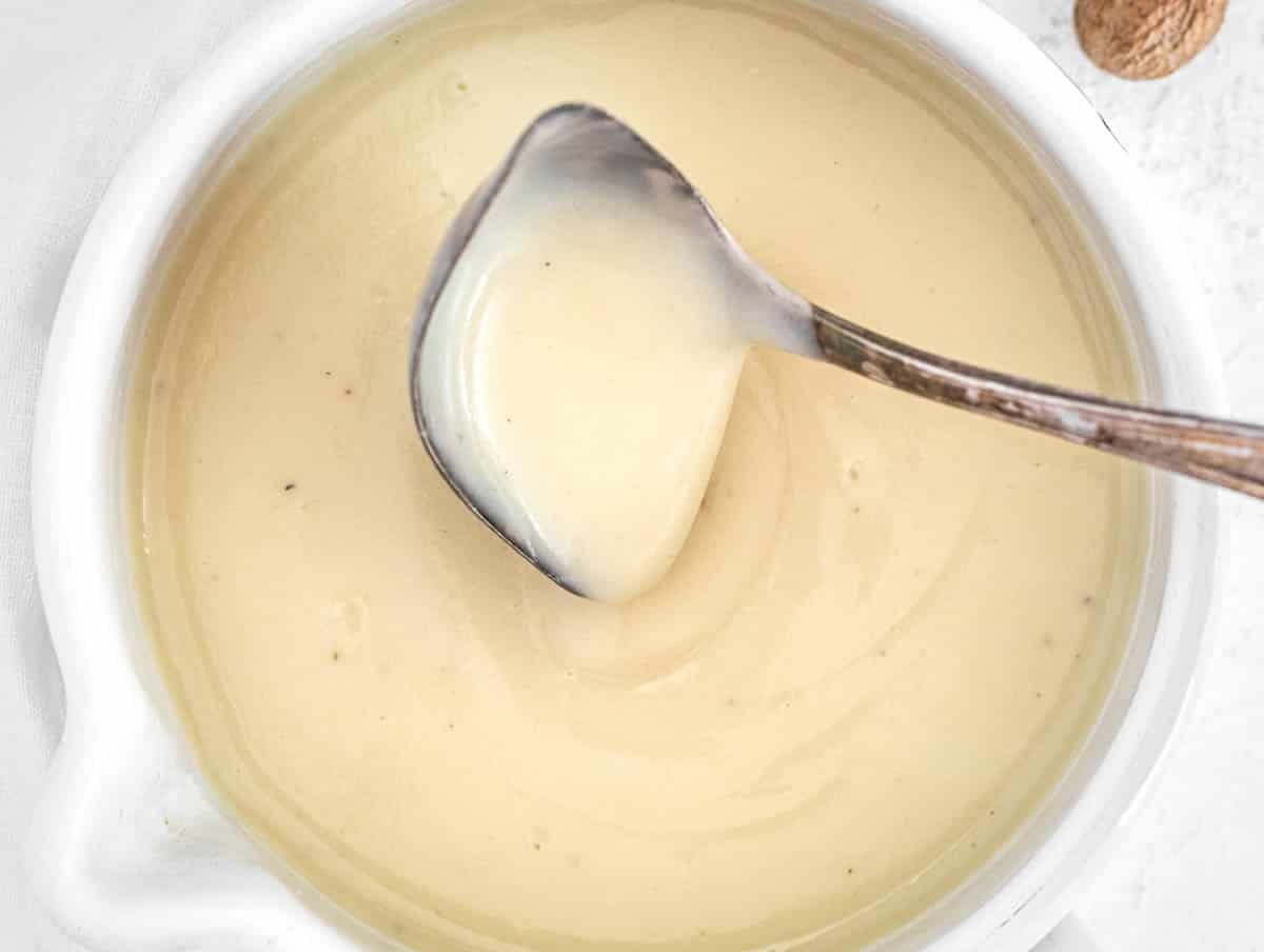 White sauce with sauce spoon