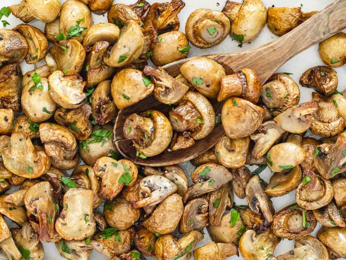 air fryer mushrooms and wooden spoon