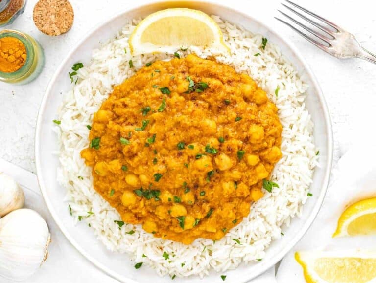 chickpea curry on a plate with rice
