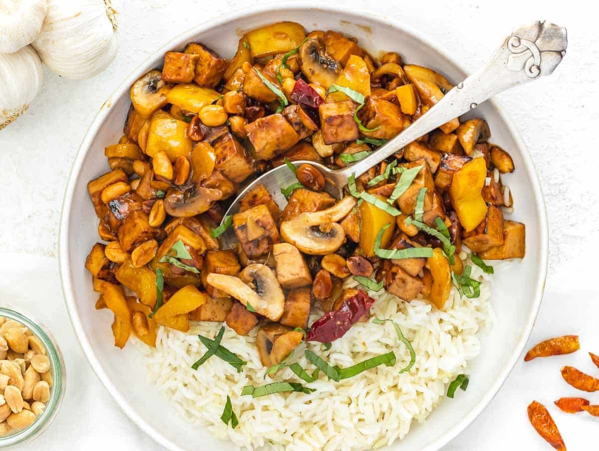kung pao tofu with rice and spoon