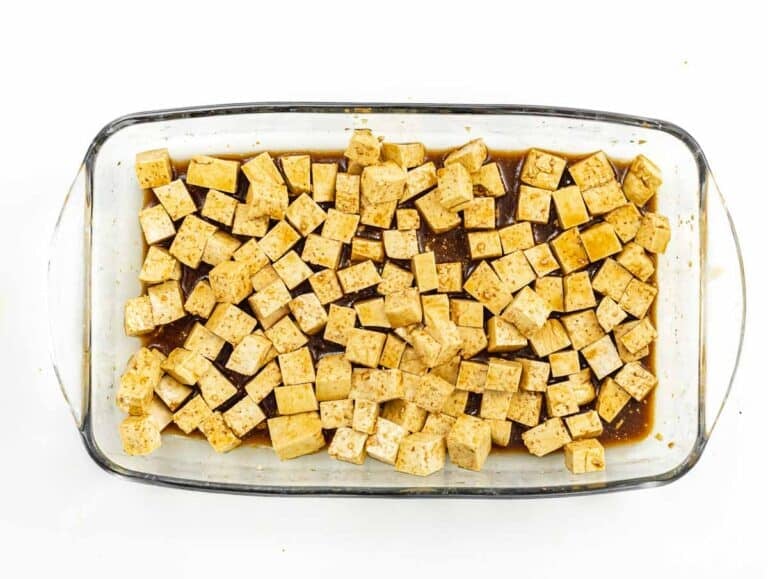 Marinade tofu cubes in sauce