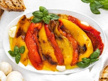 marinated bell peppers with bread and basil