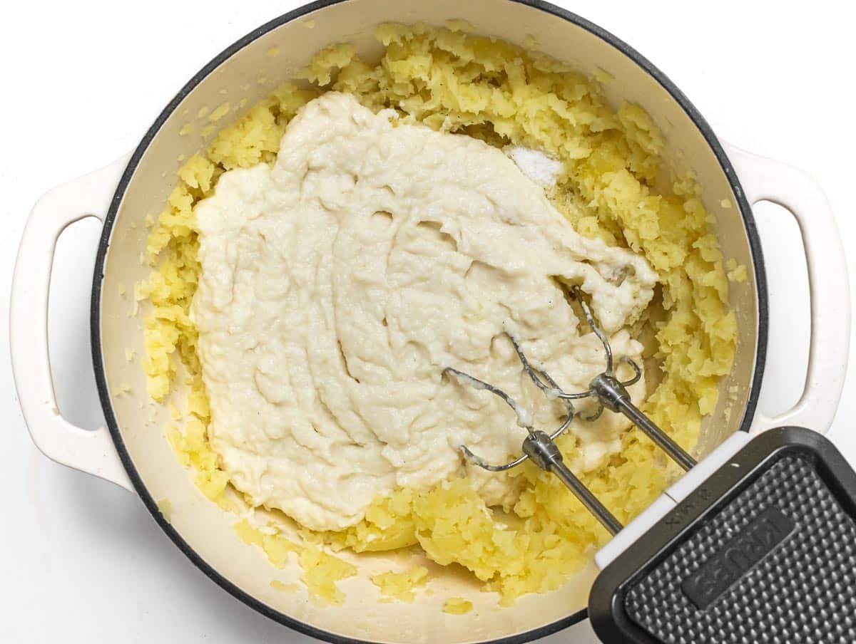 Add cauliflower mash to potatoes