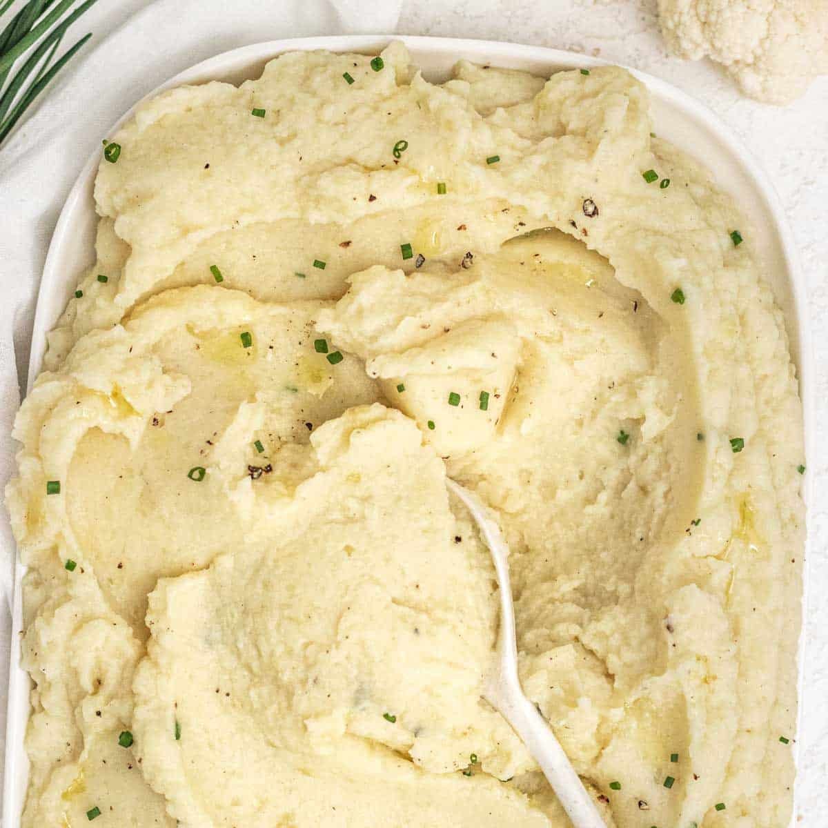 Cauliflower potato mash with spoon