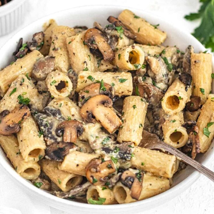 hummus pasta in a white bowl