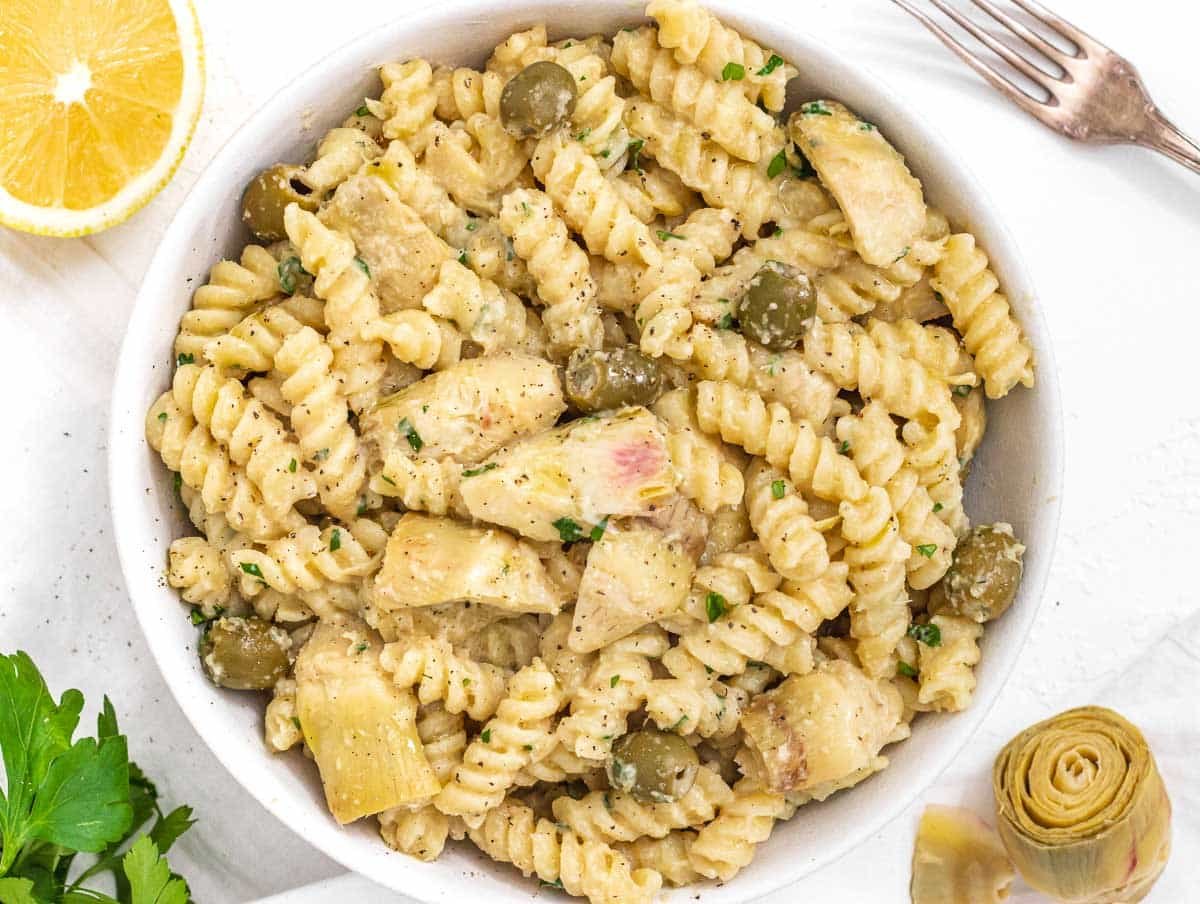 Artichoke pasta with fork and lemon