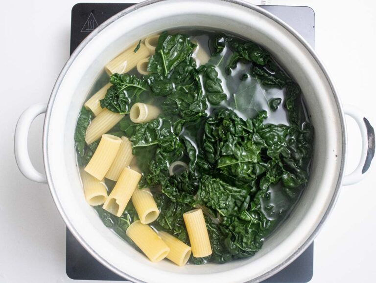 boil kale and rigatoni in a pot