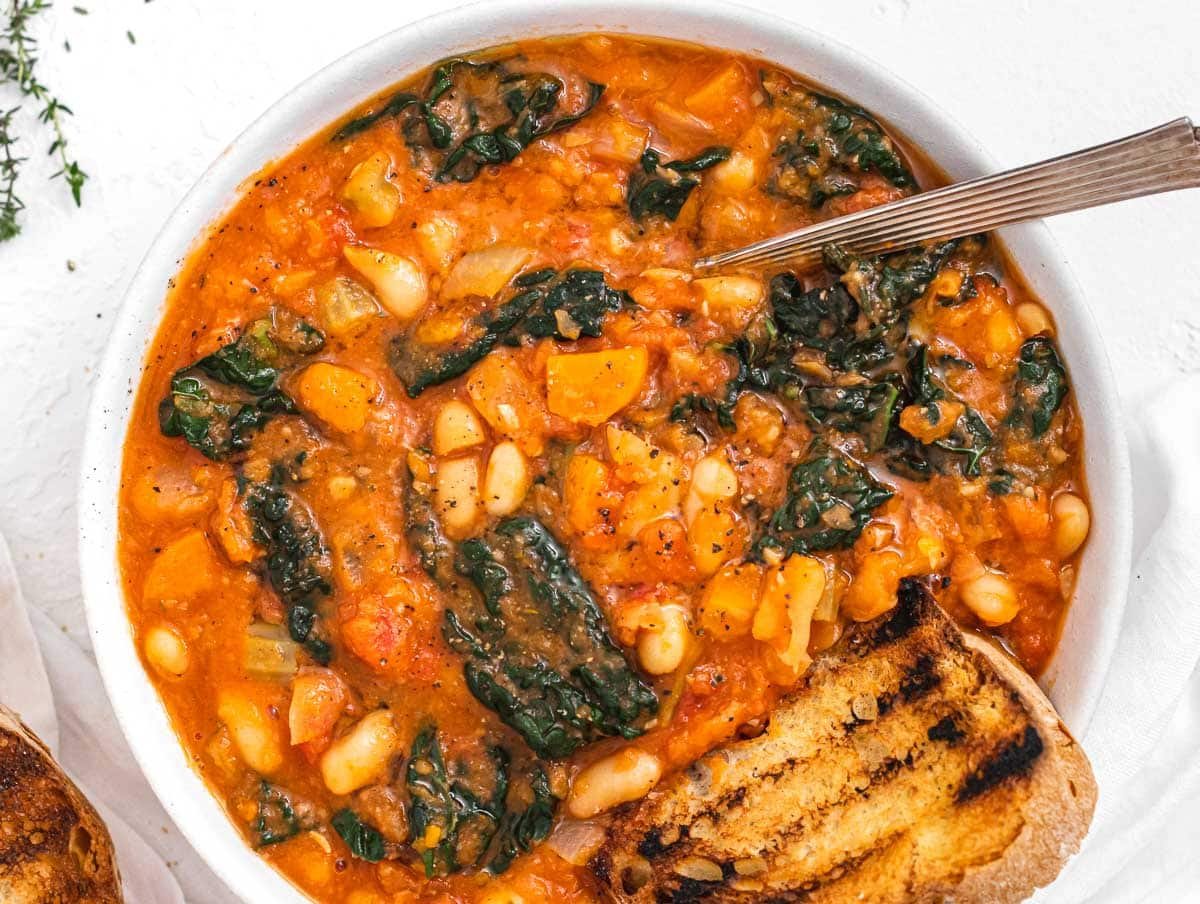 Kale soup in a bowl with spoon