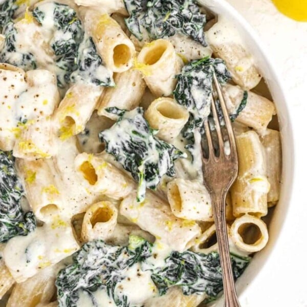 Creamy kale pasta in a bowl with fork