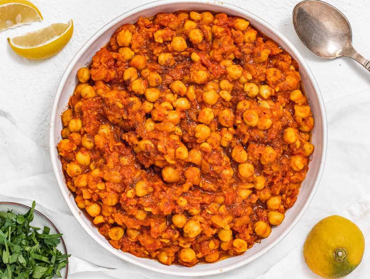 Chana masala in a bowl with spoon
