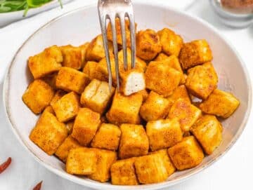 Fried tofu with a silver fork