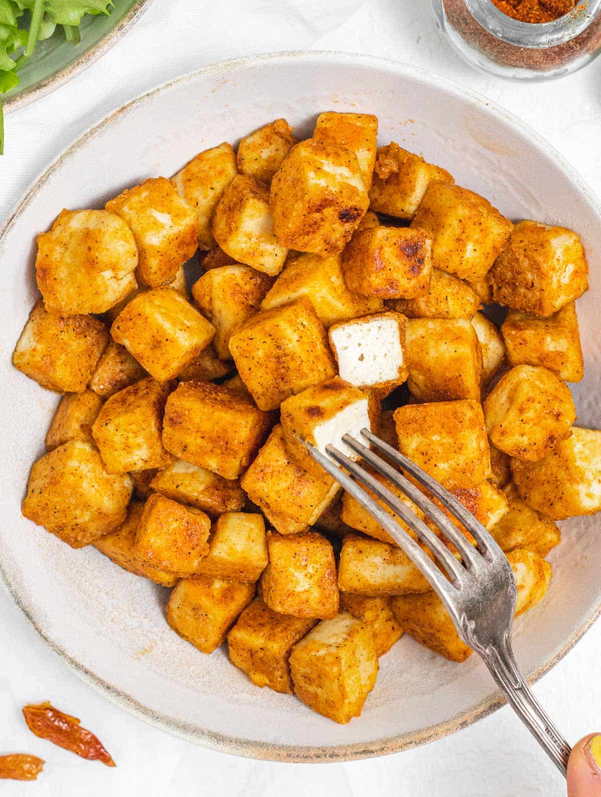 Fried tofu with silver fork