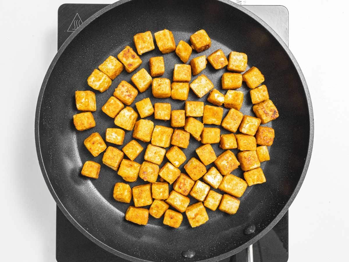 tofu frying on a pan