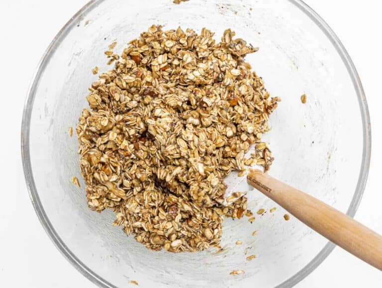 spatula and granola mix in a bowl
