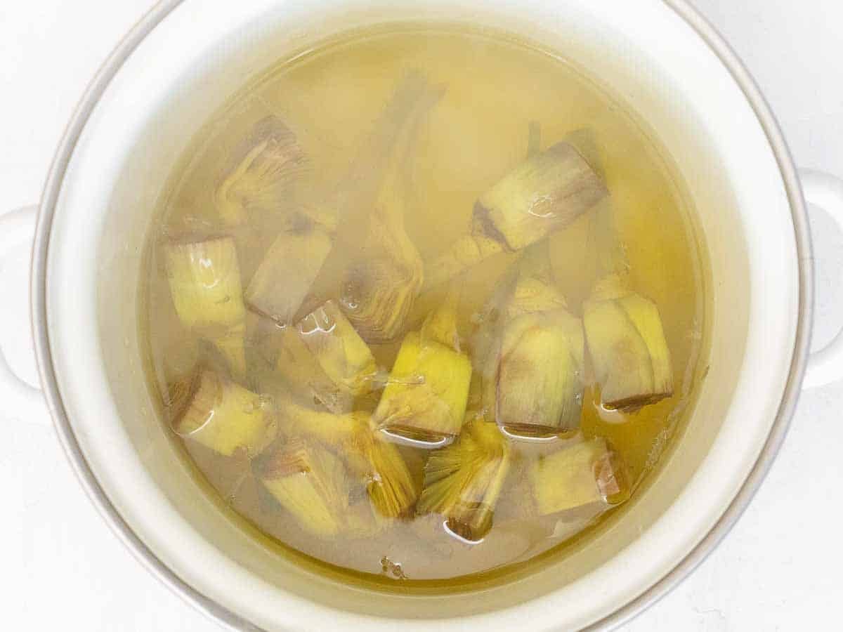 boiling the artichokes in water