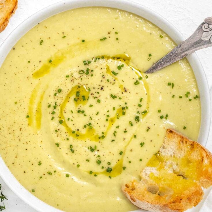 Potato leek soup with silver spoon