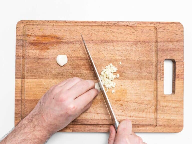 minced garlic on a cutting board