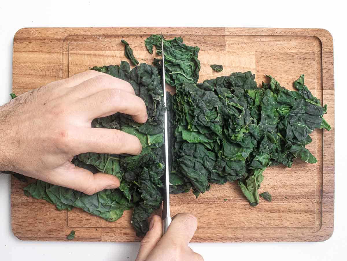 chopping the kale leaves