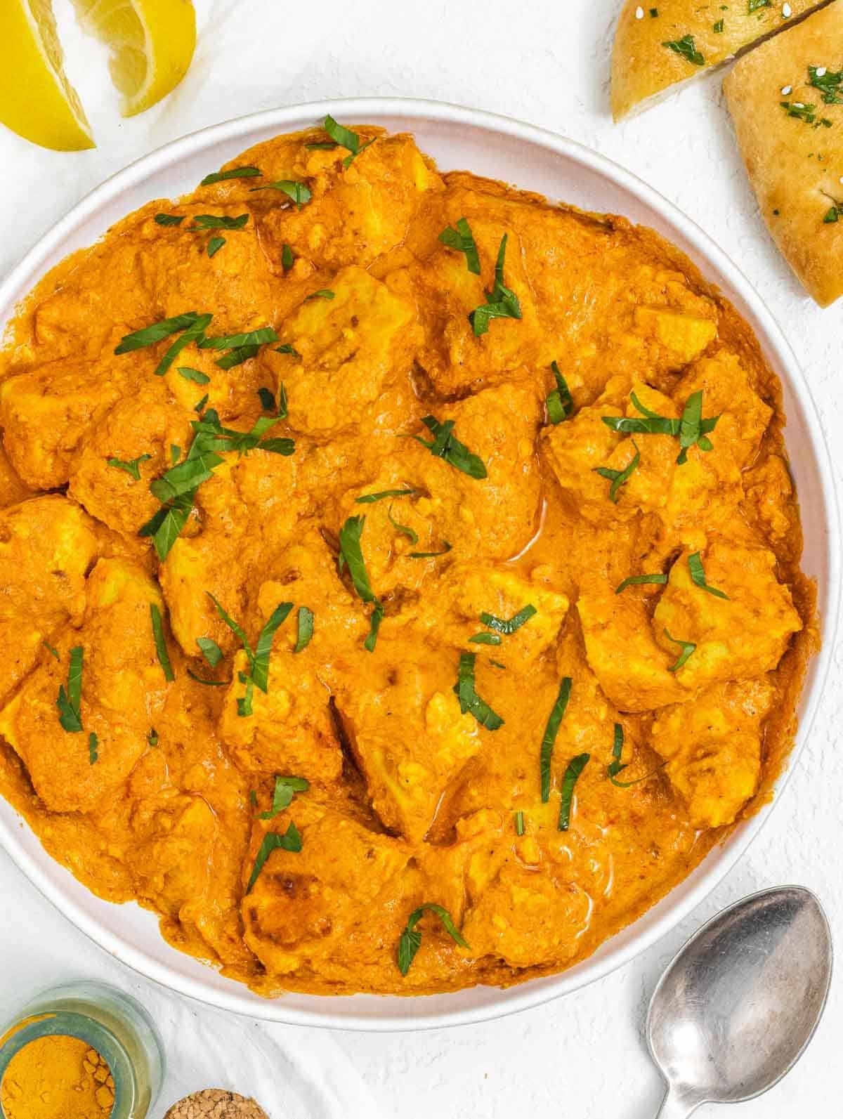 Vegan Butter Chicken on a plate with spoon