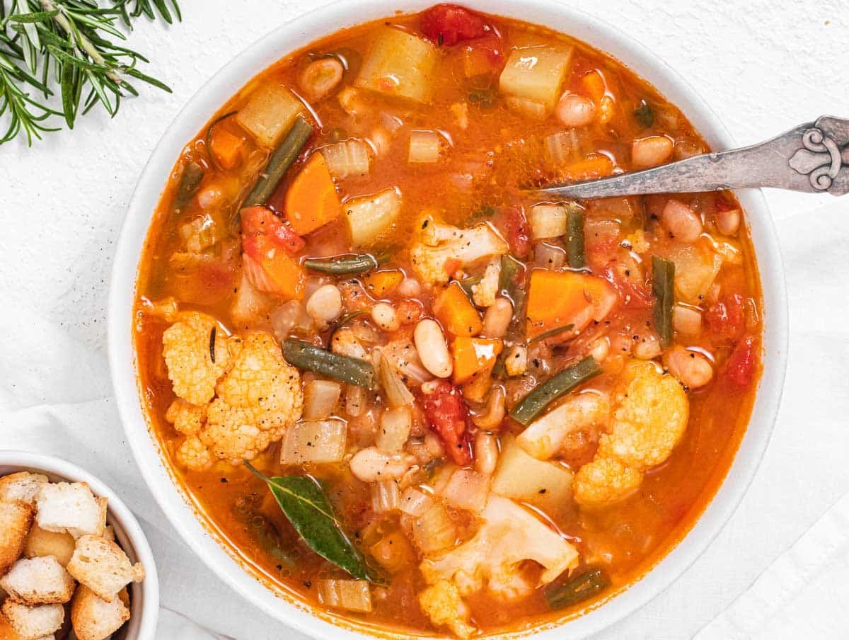 Vegetable soup with silver spoon