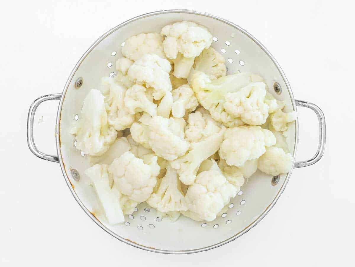 rinsed cauliflower in a sift