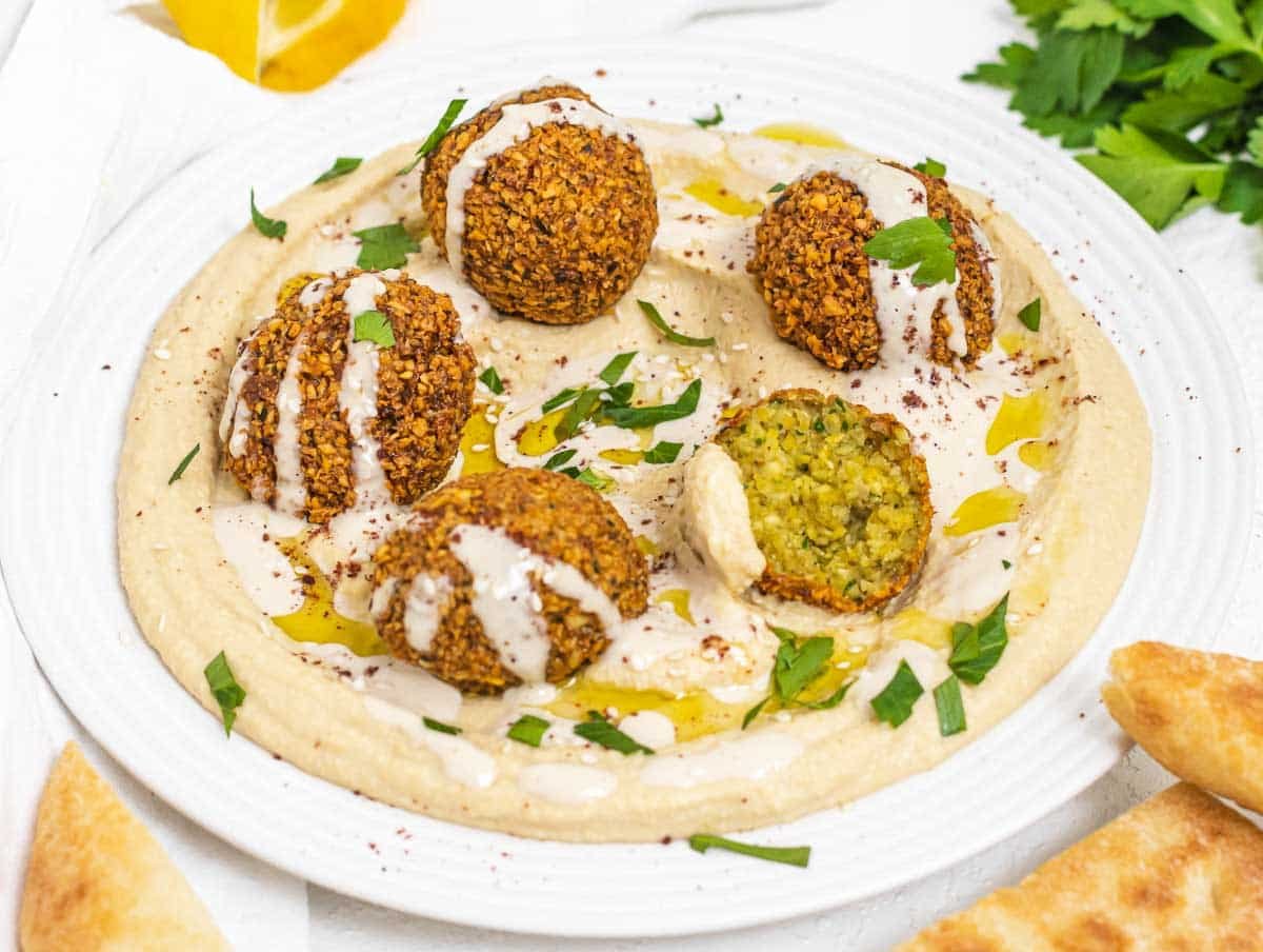 Falafel on a plate of hummus