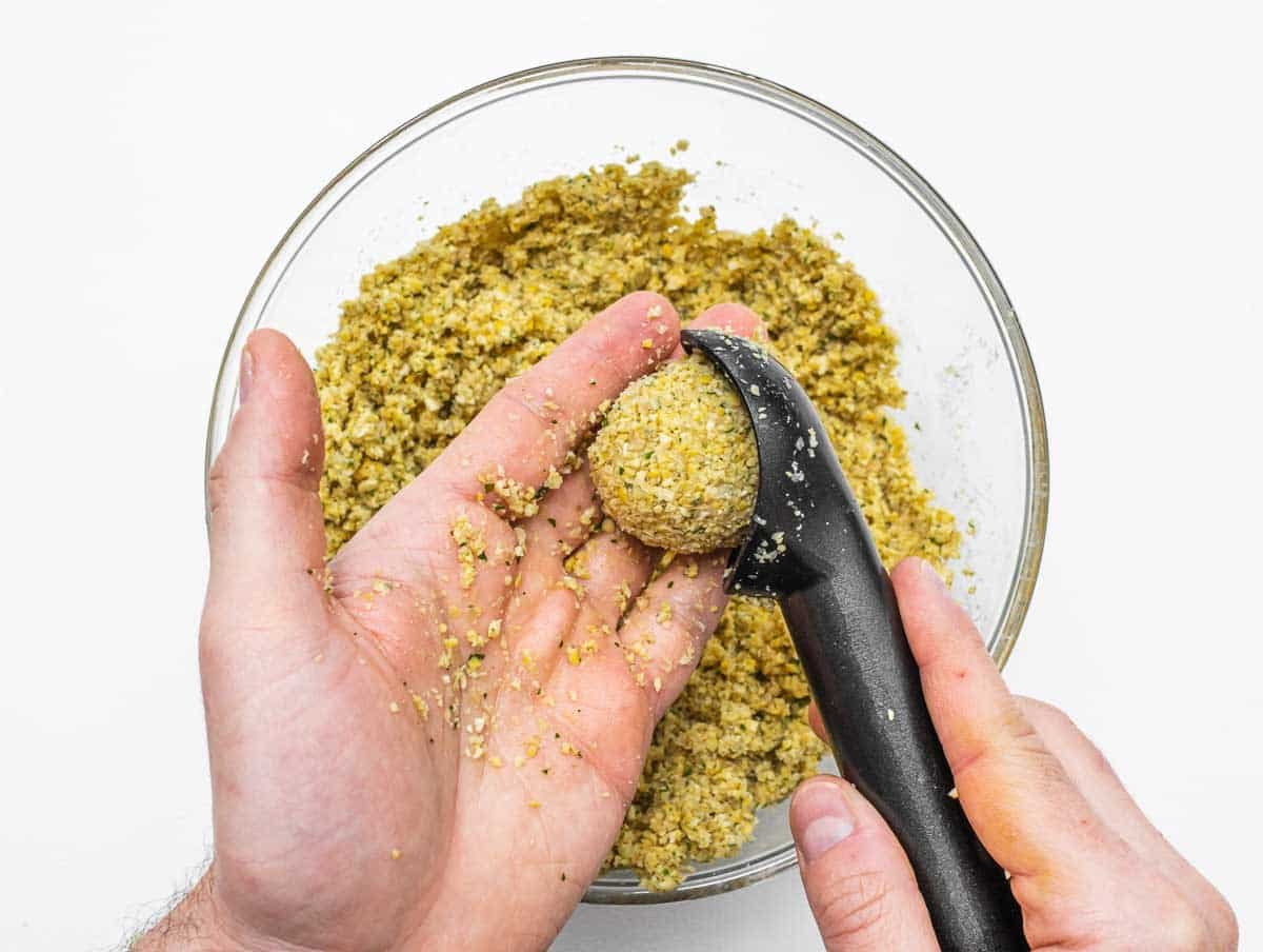 shaping the falafel with ice cream scooper