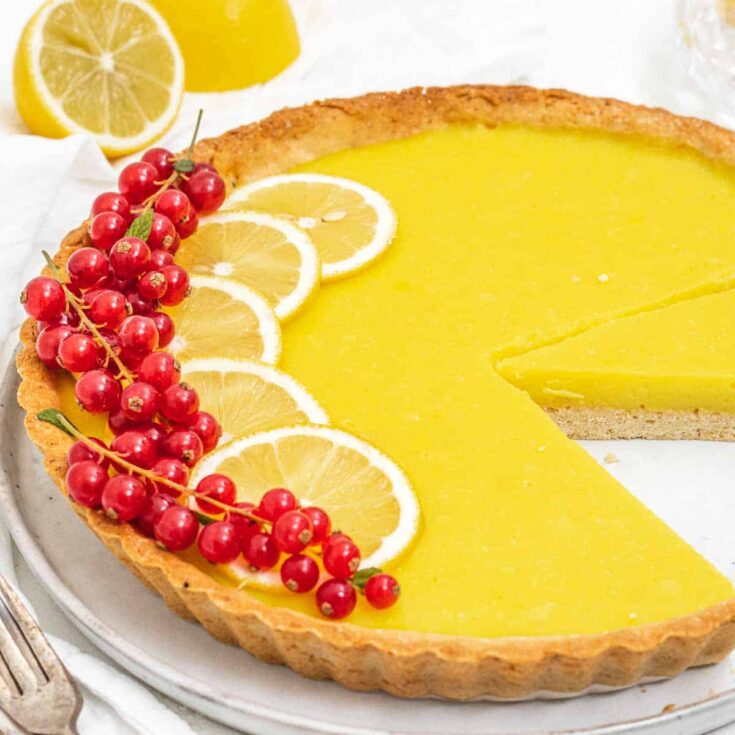 Lemon tart with lemon slices and berries