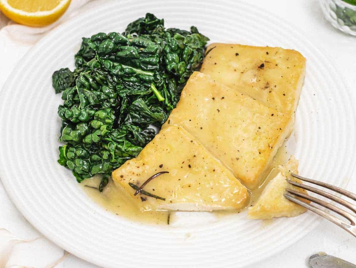 Lemon tofu with fork and kale