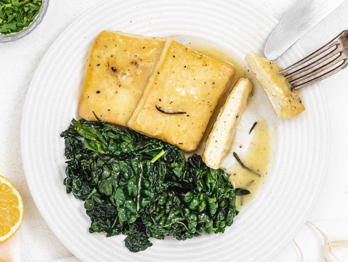 Lemon tofu with fork and knife