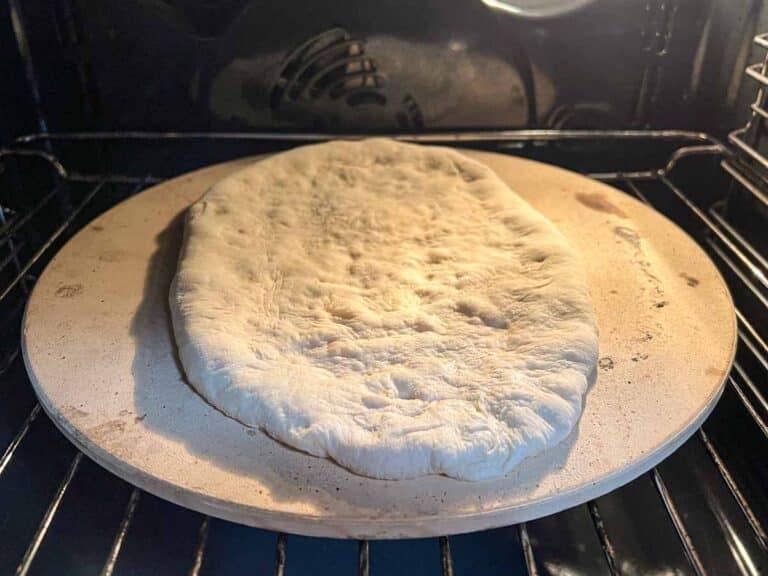 Naan bread on a pizza stone