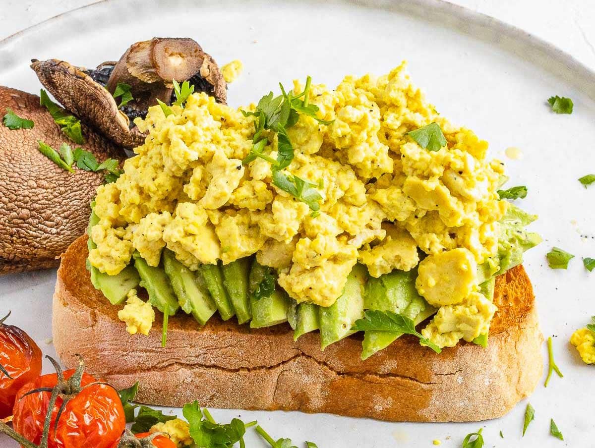 Tofu scramble on avocado and bread 