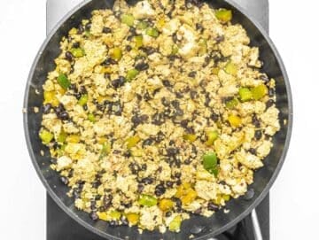 tofu scrambled in a skillet with beans