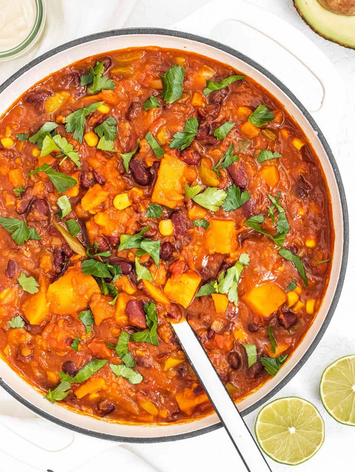 sweet potato chili with parsley and white spoon