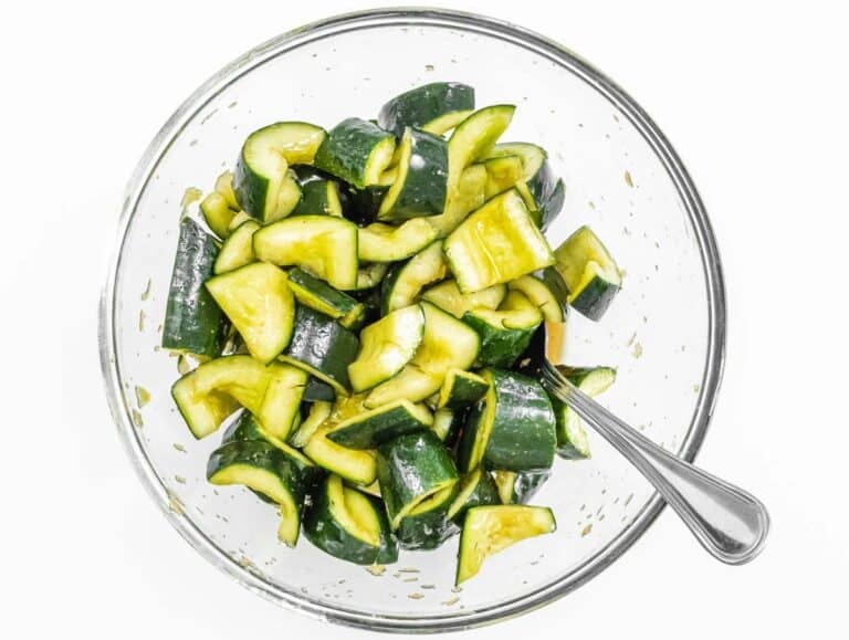 Cucumber in a bowl with dressing