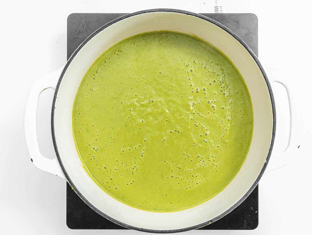 Green creamy asparagus soup in a pot