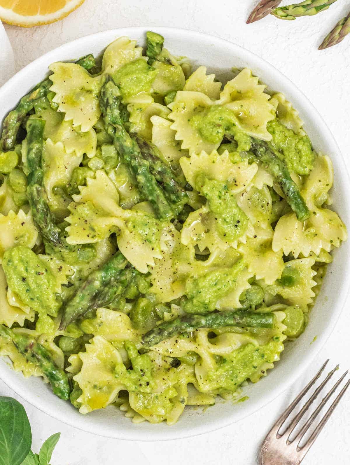 Asparagus pasta with fork and lemon