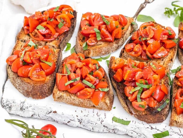 Bruschetta on a white cutting board