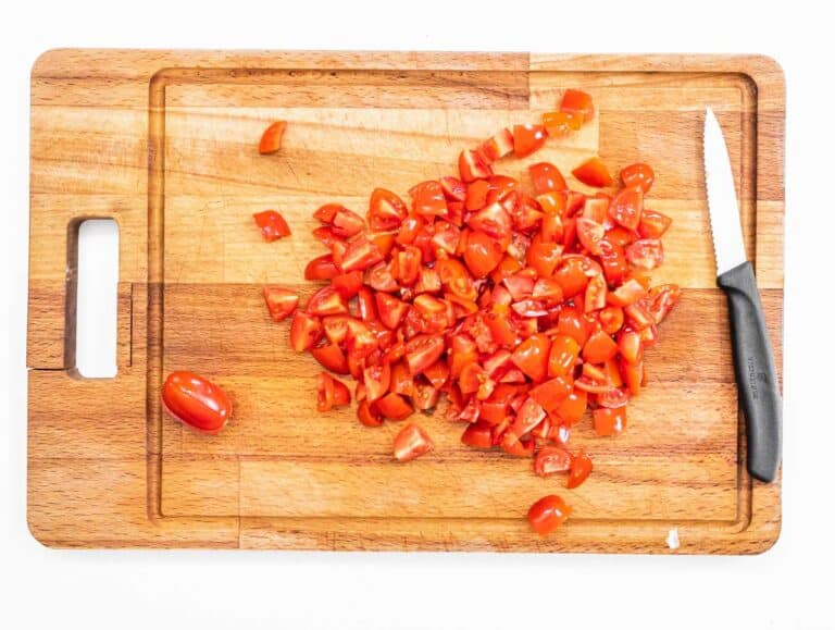 cherry tomatoes in dices and knife