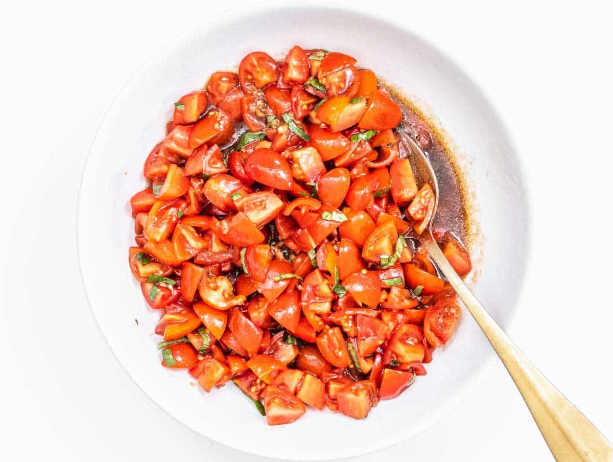 tomato mixture marinating in a bowl