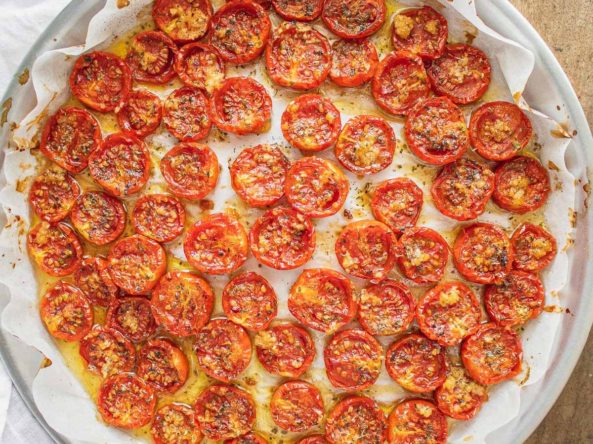 Confit tomatoes with garlic in a round tray