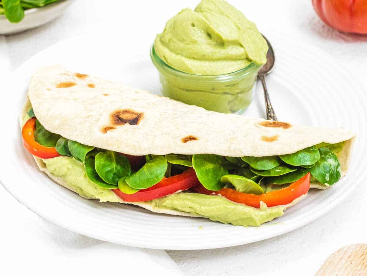 Piadina with avocado spread and tomatoes