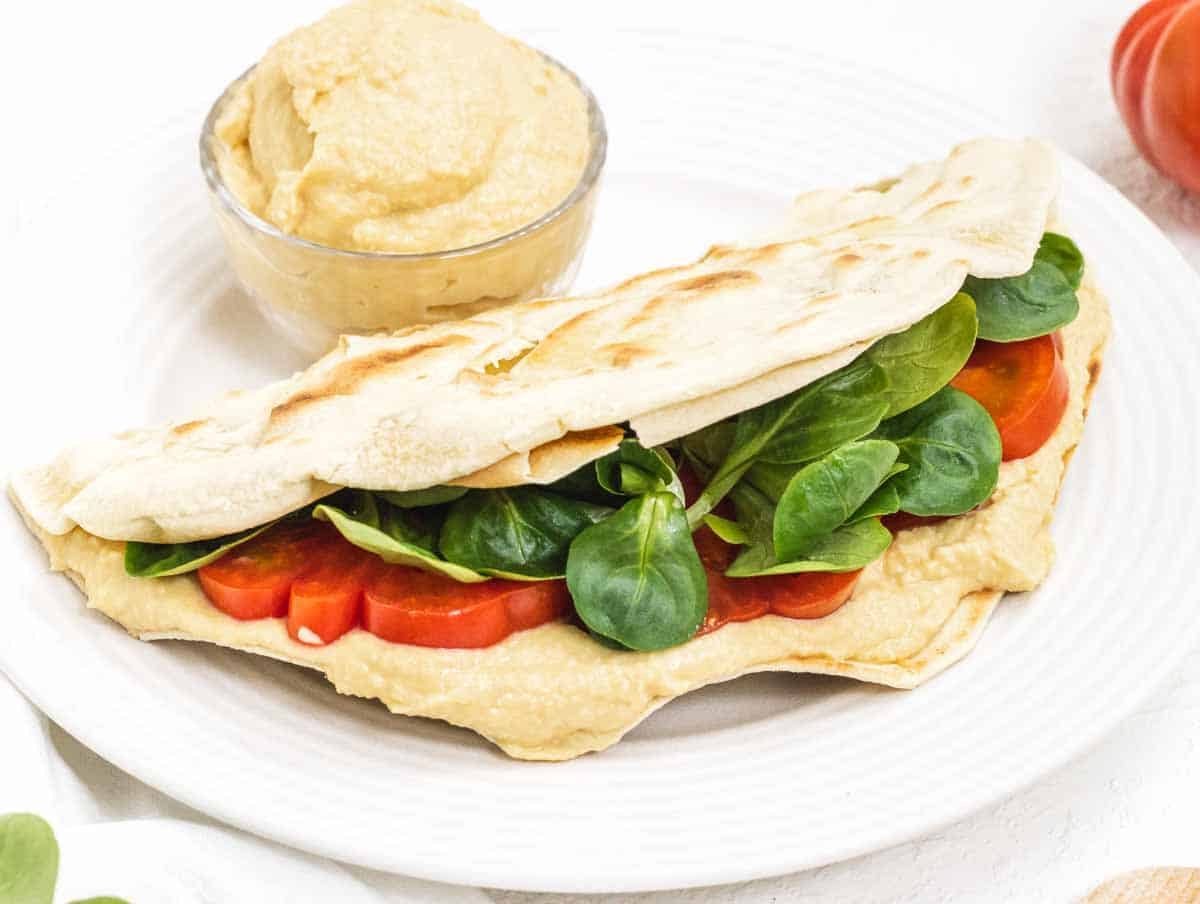 Piadina with hummus and leafy greens