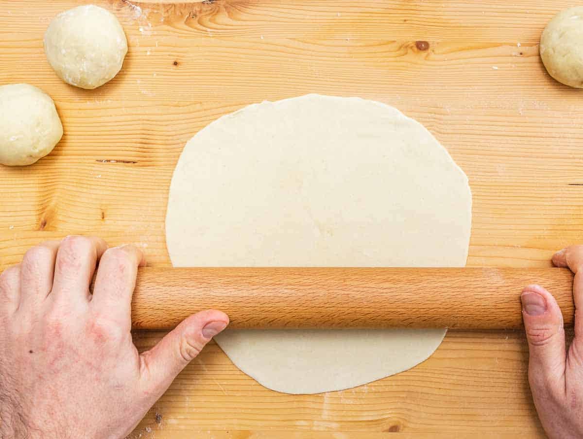 rolling out the piadina with a rolling pin