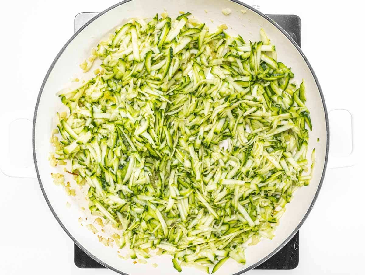 Skillet with grated zucchini