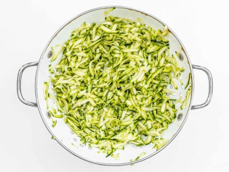Grated zucchini in a sift