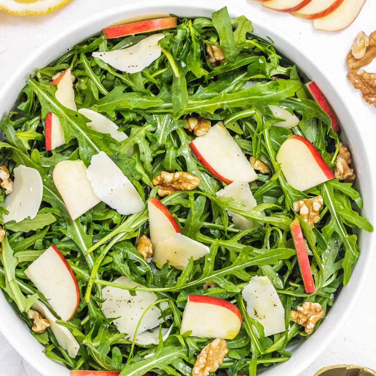 Arugula salad with walnuts and red apple