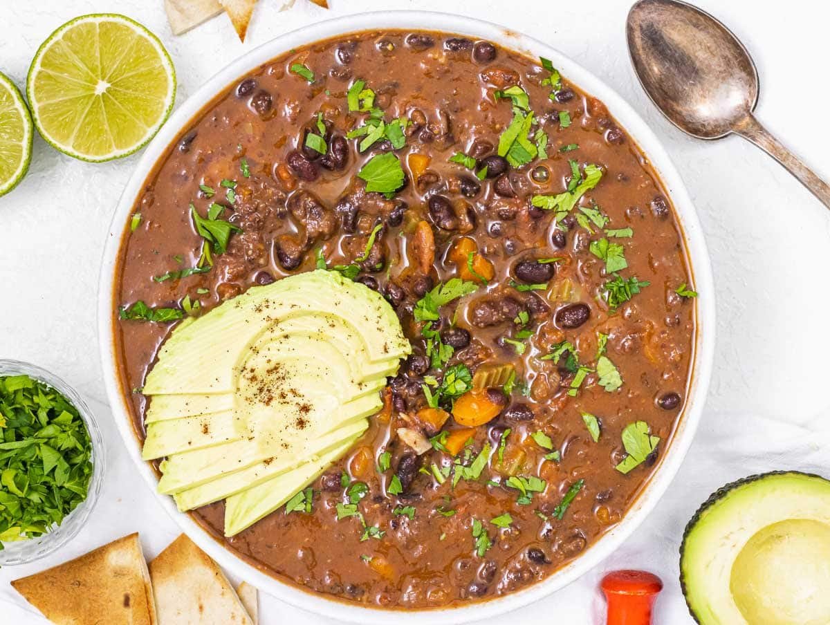 Black bean soup with avocado slices